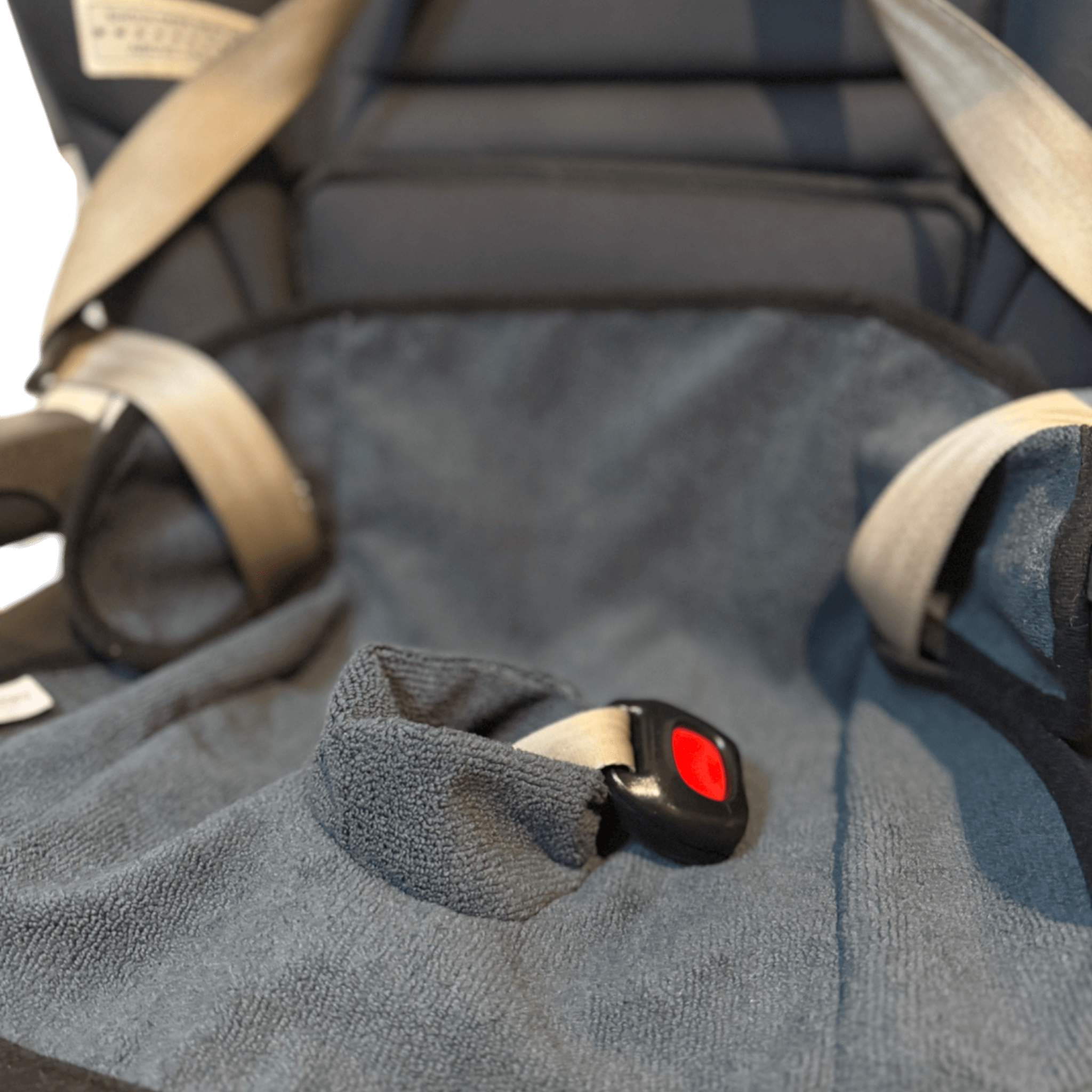 Waterproof child seat towel in charcoal grey with harness buckle in baby car seat