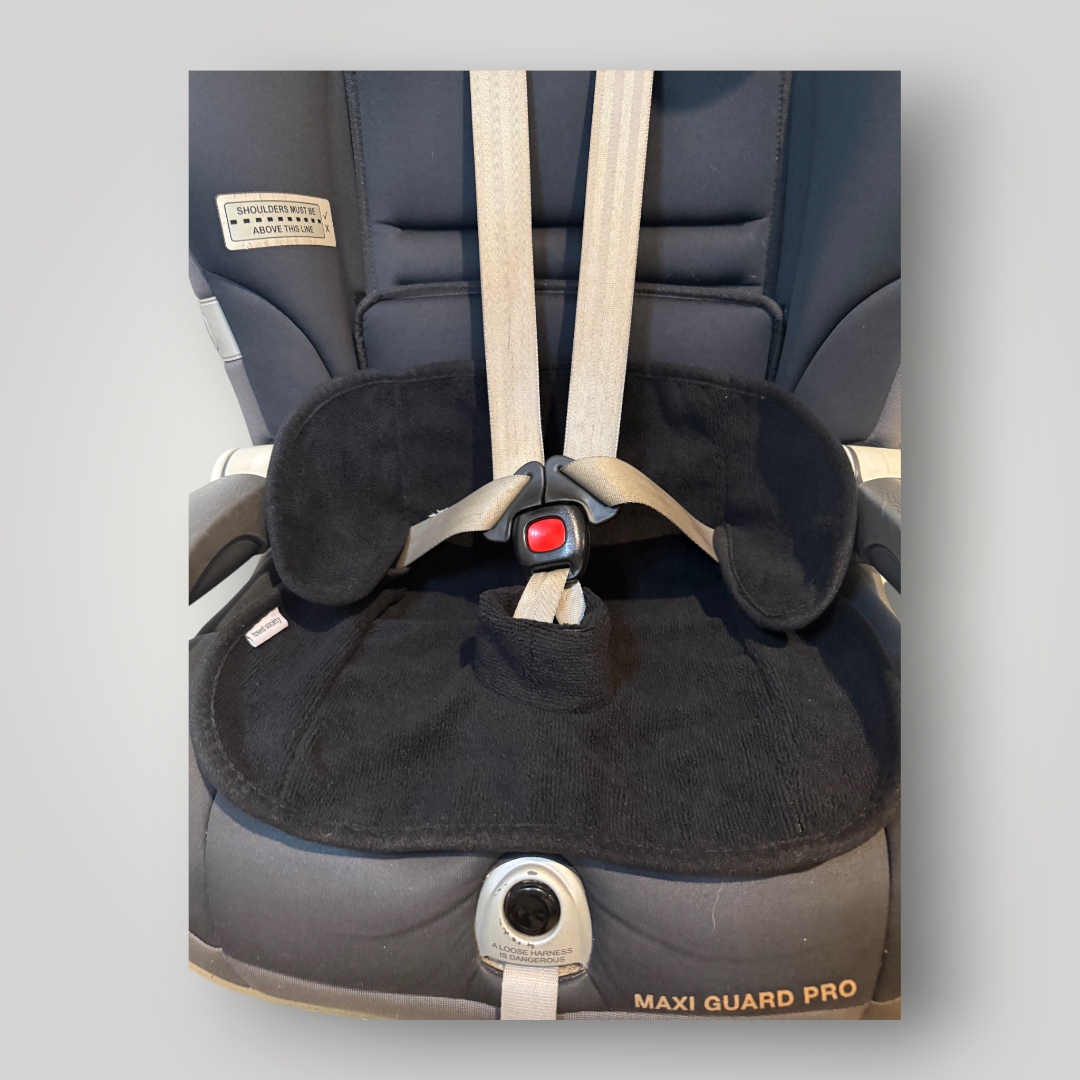 Childcar seat with waterproof black towel insert in base.