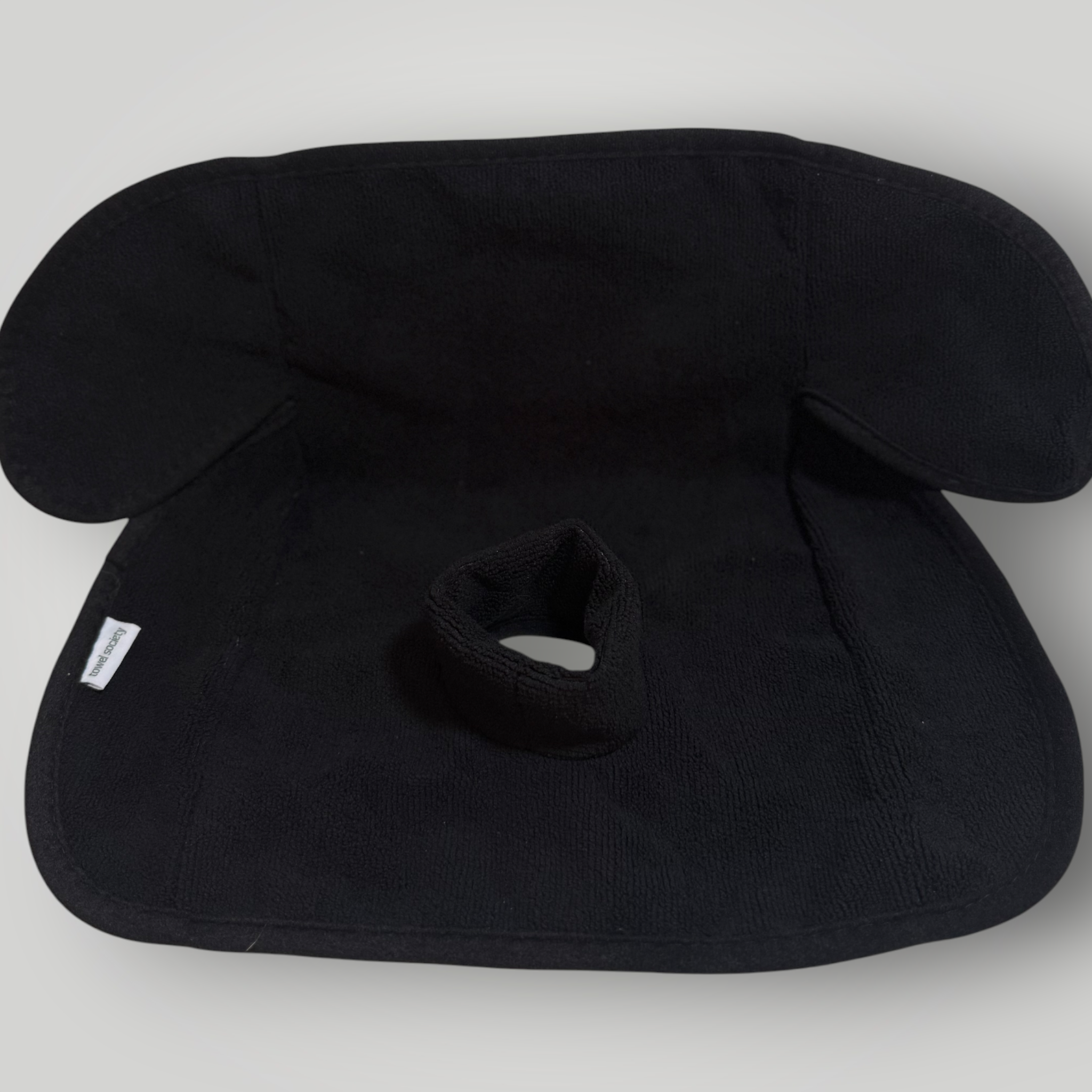 Black waterproof child seat towel on a  white background