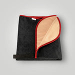 Black and red waterproof car seat towel folded