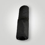 Black and red waterproof car seat towel rolled up