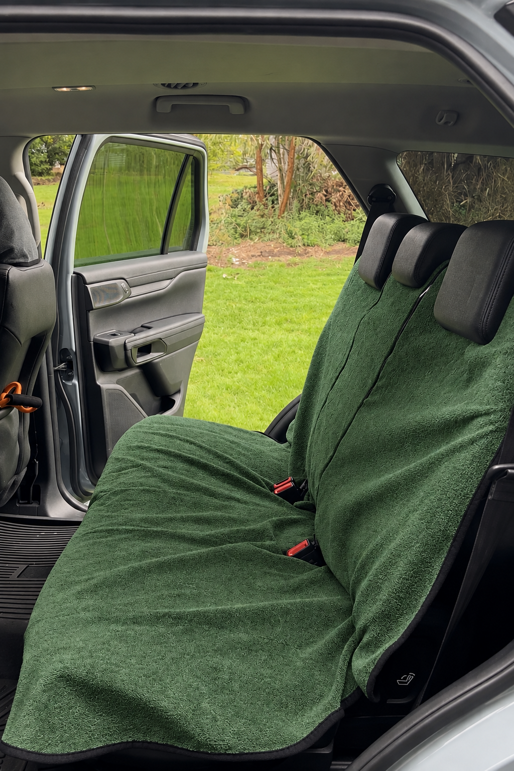 Moss Green waterproof back seat towel fitted in a car