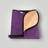 Purple towel folded with waterproof backing